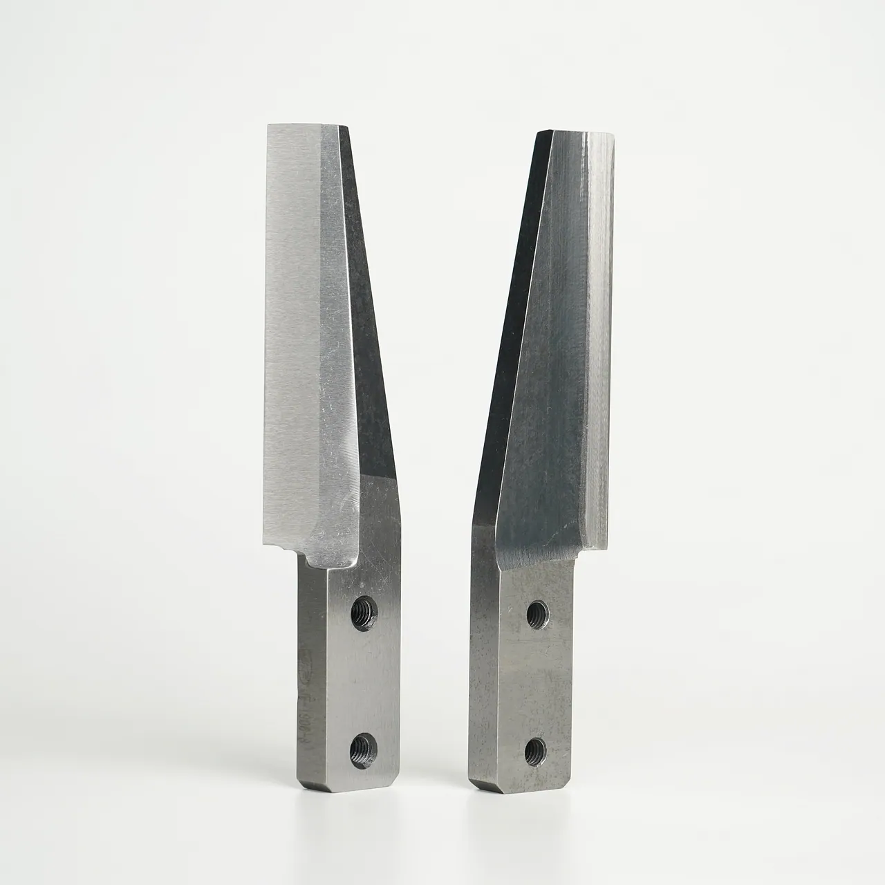 Two complete finished pelletizing knives on a neutral background