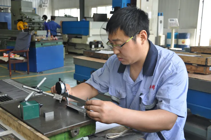 Dimensional inspection with a dial indicator on a granite surface plate