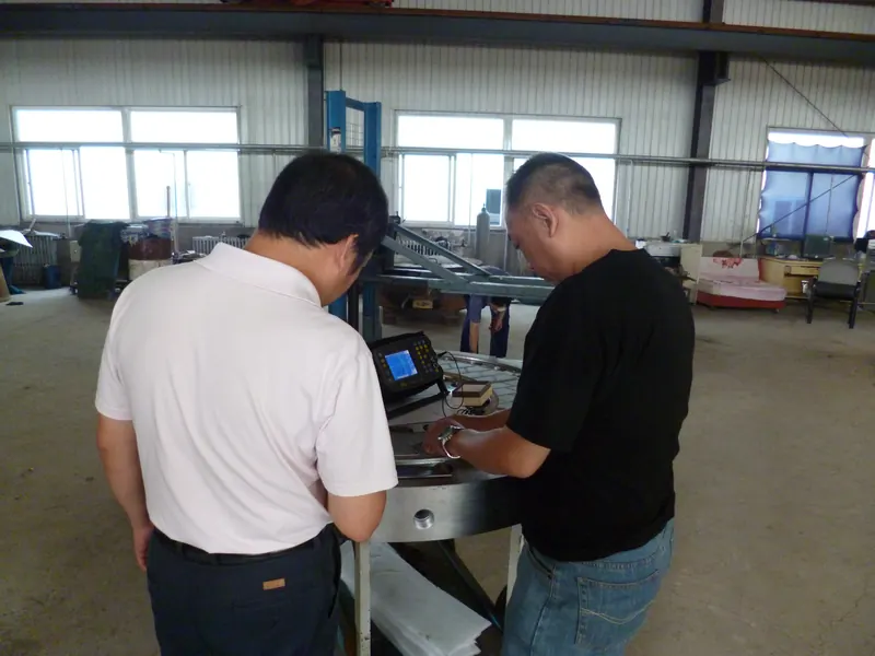Two inspectors performing flaw detection on a die plate