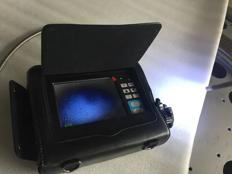 Industrial endoscope used to inspect internal passages of a die plate